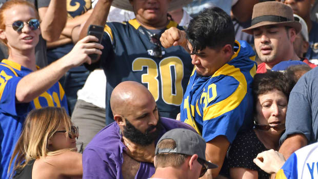 Rams fans fight in stands during NFL game